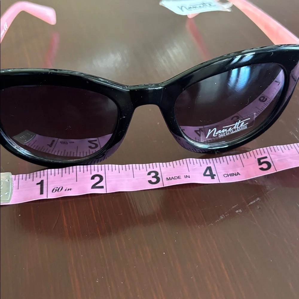 Nanette Lepore 100% UV protection,pearl pink arms,black round/square frame,NN157